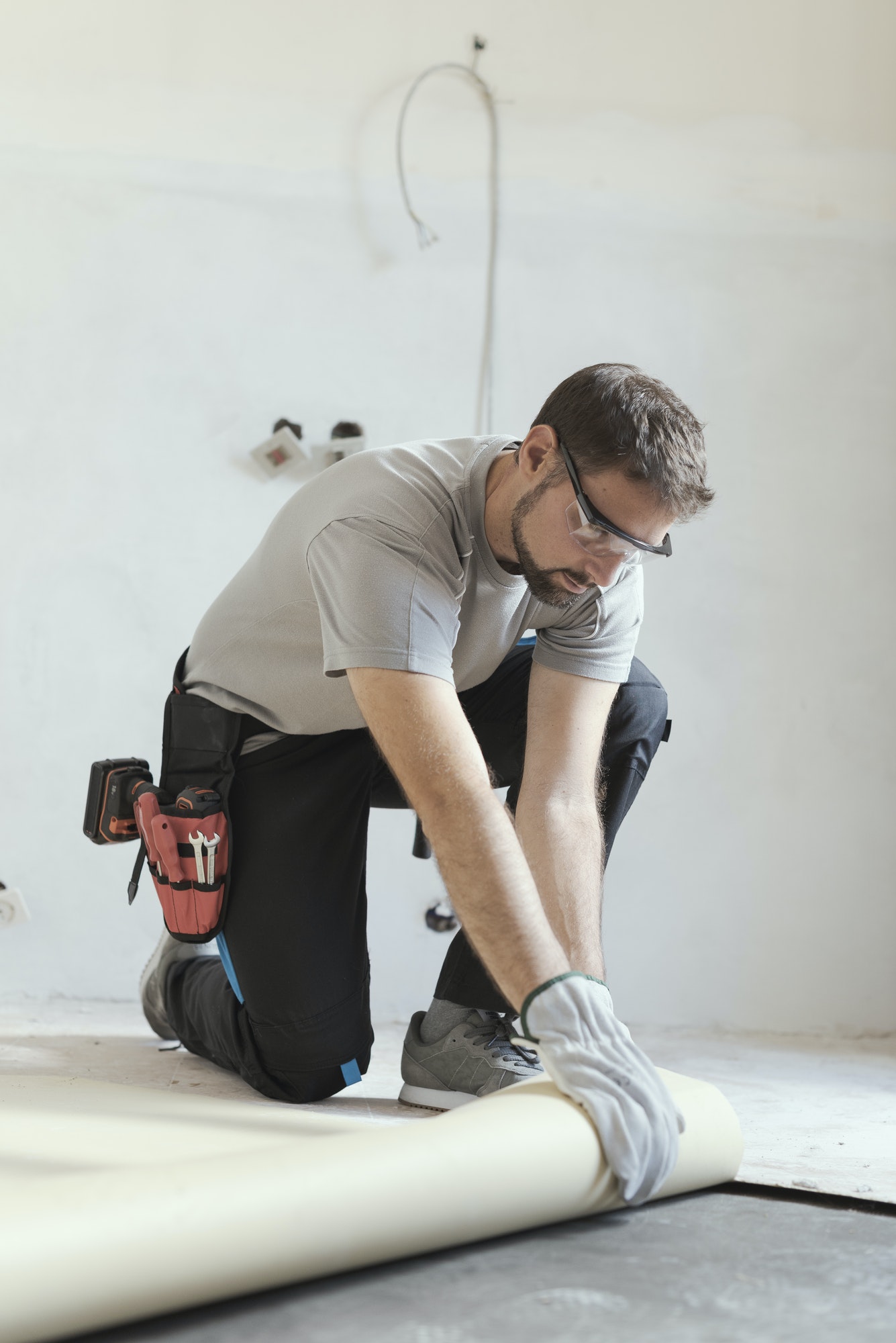 contractor removing an old linoleum flooring